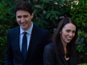 Prime Minister Justin Trudeau and New Zealand Prime Minister Jacinda Ardern are seen at a meeting at the official residence of the Canadian Ambassador in Paris on May 16, 2019.