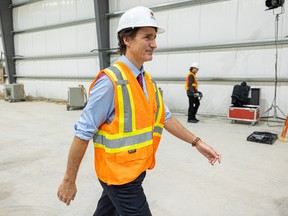 Prime Minister Justin Trudeau tours the Vital Metals rare earths element processing plant in Saskatoon. Trudeau's office later apologized to Saskatchewan Premier Scott Moe for not announcing his visit ahead of time.