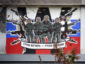 A mural depicting Russia's Wagner Group paramilitary mercenaries reads: "Wagner Group - Russian knights," on a building in Belgrade, on November 17, 2022.