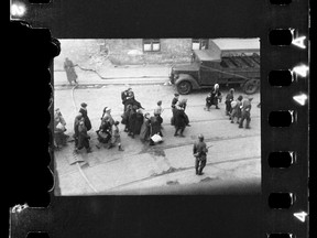 Jews being led to Umschlagplatz; photo taken from a window of St Zofia Hospital at the corner of Żelazna and Nowolipie Streets, most likely (to be confirmed) overlooking Nowolipie Street; author’s comment noted after the war at the back of the print held in the USHMM archive in Washington, DC:
”Scenes from the evacuation of the ghetto, ca 20 April 1943.”