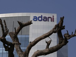 FILE- Dried branches of a tree stand outside Adani Corporate House in Ahmedabad, India, Friday, Jan. 27, 2023. India's Adani Group, run by Asia's richest man, has hit back at a report from U.S.-based short-seller Hindenburg Research, calling it "malicious", "baseless" and full of "selective misinformation."