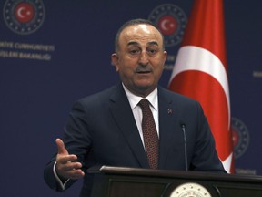 Turkish Foreign Minister Mevlut Cavusoglu speaks at a press conference in Ankara, Turkey, Thursday, Jan. 26, 2023. Cavusoglu on Thursday accused Sweden of being complicit in a "hate and racist crime" for failing to prevent weekend protests in Stockholm by an anti-Islam and pro-Kurdish groups. Cavusoglu also confirmed that a key meeting in Brussels to discuss Sweden and Finland's NATO membership, has been postponed saying such a meeting would have been "meaningless" in the wake of the protests.