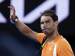 Rafael Nadal of Spain waves as he leaves Rod Laver Arena following his second round loss to Mackenzie McDonald of the U.S. at the Australian Open tennis championship in Melbourne, Australia, Wednesday, Jan. 18, 2023.