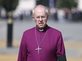 FILE - The Archbishop of Canterbury Justin Welby walks in Westminster on Sept. 14, 2022. The Church of England said Wednesday, Jan. 18, 2023, it will allow blessings for same-sex, civil marriages for the first time -- but its position on gay marriage will not change and same-sex couples will still not be able to marry in its churches. The plans, to be outlined in a report to the General Synod, which meets in London next month, came after five years of debate and consultation on the church's position on sexuality.