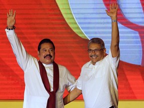 Former Sri Lankan president Mahinda Rajapaksa, left, and former Defense Secretary and his brother Gotabaya Rajapaksa wave to supporters during a party convention held to announce the presidential candidacy in Colombo, Sri Lanka on August 11, 2019. Tamil diaspora groups are praising Ottawa's sanctions on Sri Lanka officials, including the brothers, while asking Canada to bring that country to international tribunals.