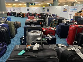 Unclaimed checked bags are shown at the Vancouver International Airport on Jan. 3, 2023. About 1,500 checked bags remain unclaimed at Vancouver International Airport after winter storms wrecked havoc on holiday travel in late December.