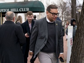 Rep. George Santos, R-N.Y., leaves a House GOP conference meeting on Capitol Hill in Washington, Wednesday, Jan. 25, 2023.