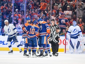 Tampa Bay Lightning defenceman Victor Hedman (77) and goalie Andrei Vasilevskiy (88) look on as the Edmonton Oilers celebrate a goal during first period NHL action in Edmonton on Thursday January 19, 2023.THE CANADIAN PRESS/Jason Franson