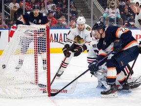 Chicago Blackhawks' goalie Petr Mrazek (34) is scored on by Edmonton Oilers' Tyson Barrie (22) during second period NHL action in Edmonton on Saturday January 28, 2023.THE CANADIAN PRESS/Jason Franson