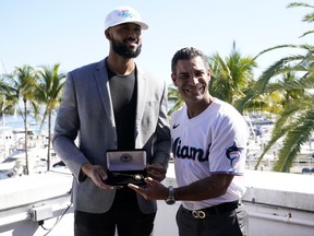 Miami Marlins pitcher Sandy Alcantara, left, the 2022 National League Cy Young winner, holds the key to the City of Miami presented to him by Miami Mayor Francis Suarez at Miami City Hall, Tuesday, Jan. 10, 2023, in Miami.