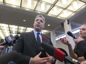 Tom Stamatakis, President of the Canadian Police Association, talks to media at City Hall in Winnipeg.