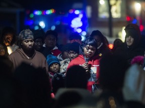 Family members of Nicous D'Andre Spring attend a vigil in his memory in Montreal, Friday, Dec. 30, 2022. The family of a Montreal man who died after an altercation with guards at a detention centre while unlawfully detained is demanding an inquiry into his death.