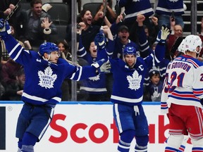 Toronto Maple Leafs defenceman Timothy Liljegren (37) celebrates his goal against the New York Rangers with Maple Leafs forward John Tavares (91) during third period NHL hockey action in Toronto on Wednesday, January 25, 2023. Ontario's sports-betting market experienced a 71 cent increase in total gaming revenue in the third fiscal quarter, according to figures released Thursday by iGaming Ontario. THE&ampnbsp;CANADIAN PRESS/Nathan Denette