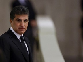 FILE - President of the Kurdistan region in Iraq, Nechirvan Barzani pays his respects to Britain's Queen Elizabeth II, following her death, during her lying in state at Westminster Hall, in Westminster Palace, in London, Sunday, Sept. 18, 2022. Iraqi Kurdish authorities on Thursday, Jan. 26, 2023, pushed back against a decision by Iraq's top court that blocked payments from the central government funding the semi-autonomous region.