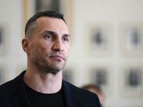 FILE - Former heavyweight boxing world champion Wladimir Klitschko leaves after a meeting with German Economy and Climate Minister Robert Habeck in Berlin, March 31, 2022. Olympic gold medalist Wladimir Klitschko has joined Ukraine's fight against IOC plans to let some Russians compete at the 2024 Paris Summer Games, it was announced Tuesday, Jan. 31, 2023. The former heavyweight world champion has suggested in a video message sports leaders will be accomplices to the war if athletes from Russia and its military ally Belarus can compete at the next Olympics.