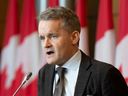 Labour Minister Seamus O’Regan speaking during a news conference in Ottawa.