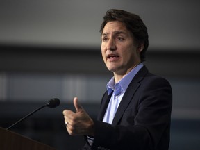 Prime Minister Justin Trudeau speaks to the media at the McMaster Automotive Resource Centre, in Hamilton, Ont., during the final day of meetings at Liberal cabinet retreat, on Wednesday, Jan. 25, 2023.