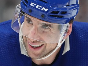 Toronto Maple Leafs centre John Tavares (91) smiles as he is about to take a face off during second period NHL hockey action against the Winnipeg Jets in Toronto on January 19, 2023.