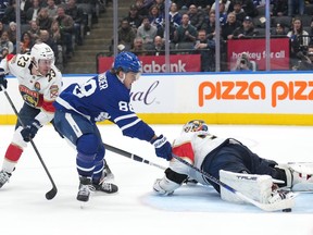 Toronto Maple Leafs forward William Nylander (88) scores the game-winning goal against Florida Panthers goaltender Sergei Bobrovsky (72) as forward Carter Verhaeghe (23) looks on during the overtime period of NHL hockey action in Toronto on Tuesday, January 17, 2023.