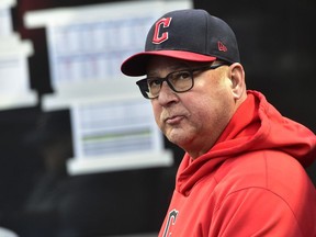 FILE - Cleveland Guardians manager Terry Francona looks on from the dugout before Game 4 of a baseball AL Division Series against the New York Yankees, Sunday, Oct. 16, 2022, in Cleveland. The scooter that Francona rides from his downtown Cleveland apartment to Progressive Field was swiped over the weekend. Francona's scooter was parked outside his residence. A team spokesman said police were notified of the theft, which happened late Friday night or early Saturday Jan. 21.