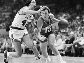 FILE - Boston Celtics Chris Ford (42), left, defends against Houston Rockets' Mike Dunleavy (10) during an NBA basketball playoff game in Boston, April 12, 1980. Boston won 95-75. Chris Ford, a member of the Boston Celtics 1981 championship team, a longtime NBA coach and the player credited with scoring the league's first 3-point basket, has died, his family announced in a statement. He was 74. The family revealed the death through the Celtics on Wednesday. No official cause was given, but the statement said Ford passed away on Tuesday, Jan. 17, 2023.