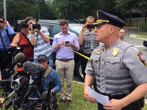 FILE - Fairfax County Police Chief Edwin Roessler briefs reporters on reports of a man with a gun entering the USA Today headquarters building on Aug. 7, 2019, in McLean, Va. A woman who says she was lured from Costa Rica into a Virginia-based sex-trafficking ring has named the former police chief and three other officers as clients who allowed the enterprise to operate. A federal jury in Alexandria, Va., began hearing testimony Tuesday, Jan. 10, 2023, in the civil trial against the four officers, including Roessler.