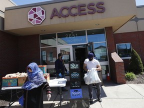 FILE - Workers at ACCESS, the Arab Community Center for Economic and Social Services, help with meals for the Arab community in Dearborn, Mich., on May 1, 2020. A Middle Eastern and North African category would be added to U.S. federal surveys and censuses, and changes would be made to how Hispanics are able to self-identify, under preliminary recommendations released Thursday, Jan. 26, 2023, by the Biden administration in what would be the first update to race and ethnicity standards in a quarter century.