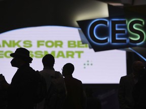 FILE - Attendees wait for the main show floor to open at the CES tech show Wednesday, Jan. 5, 2022, in Las Vegas. The annual tech industry event formerly known as the Consumer Electronics Show is returning to Las Vegas this week, Tuesday, Jan. 3, 2023 with the hope that it looks more like it did before the coronavirus pandemic. The show changed its name to CES several years ago to better reflect the changing industry and the event.
