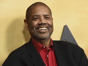 FILE - Gregory Allen Howard arrives at the Los Angeles premiere of "Harriet" on Oct. 29, 2019. Howard, who skillfully adapted stories of historical Black figures in "Remember the Titans" starring Denzel Washington, "Ali" with Will Smith and "Harriet" with Cynthia Erivo, died Friday at a hospital in Miami of heart failure, according to publicist Jeff Sanderson. He was 70.