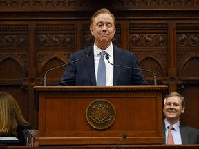 FILE - Connecticut Gov. Ned Lamont delivers the State of the State address during the opening session of the Legislature at the State Capitol, Wednesday, Jan. 4, 2023, in Hartford, Conn.