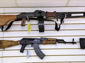FILE - Assault style weapons are displayed for sale at Capitol City Arms Supply on Jan. 16, 2013, in Springfield, Ill. An Illinois appellate court on Tuesday, Jan. 31, 2023, upheld a temporary restraining order on enforcement of the state's three-week-old law banning semiautomatic weapons enacted largely in response to the mass shooting at an Independence Day parade in the Chicago suburb of Highland Park, Ill.