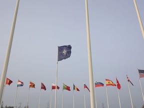 Flags of NATO members fly outside the NATO headquarters ahead of NATO Secretary General Jens Stoltenberg, European Commission President Ursula von der Leyen and European Council President Charles Michel signing a joint declaration on NATO-EU Cooperation at NATO headquarters in Brussels, Tuesday, Jan. 10, 2023.