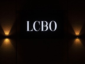 The LCBO logo illuminated on the wall of a store.