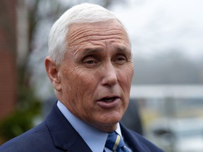 FILE - Former Vice President Mike Pence speaks with reporters, Dec. 6, 2022, at Garden Sanctuary Church of God in Rock Hill, S.C.