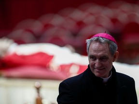 Archbishop Georg Gaenswein pays homage to former Pope Benedict in St. Peter's Basilica at the Vatican, Jan. 2, 2023.