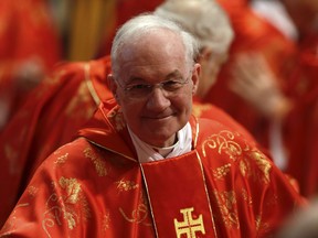 Canadian Cardinal Marc Ouellet attends a Mass inside St. Peter's Basilica, at the Vatican, on March 12, 2013.