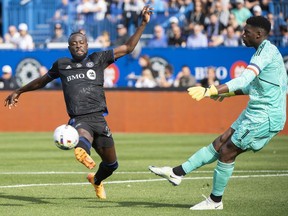 CF Montréal forward Kei Kamara (23) moves in on New York City goalkeeper Sean Johnson (1) during first half Eastern Conference semifinals MLS playoff soccer action in Montreal, Sunday, October 23, 2022. Montreal's busy off-season continued Friday, as Kamara reported to the club for the first time since his recent public trade request.