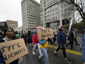 Protesters march in front of police headquarters on Saturday, Jan. 28, 2023, in Memphis, Tenn., over the death of Tyre Nichols, who died after being beaten by five Memphis police officers.