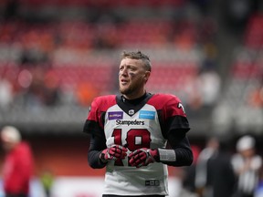 Calgary Stampeders quarterback Bo Levi Mitchell warms up before the CFL western semi-final football game against the B.C. Lions in Vancouver on Sunday, November 6, 2022. The Hamilton Tiger-Cats announced Tuesday that Mitchell has signed a three-year deal with the club.