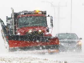 A South Dakota state snow plow clears a shoulder along Highway 50 on the north edge of Yankton, S.D., on Thursday, Dec. 15, 2022, as light snow swept by strong winds reduced visibility to a quarter-mile at times. Yankton is about 200 miles east of the Rosebud Sioux Reservation, which was battered by a mid-December snowstorm that left roads impassable. A 12-year-old asthmatic boy was among six people who died on the reservation during the storm. The tribe says all of the deaths could have been prevented were it not for systemic failures and a lack of timely help.