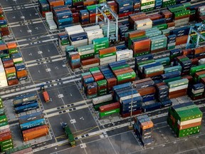 Shipping containers sit next to gantry cranes at Port Klang, Malaysia in this aerial photograph taken over Klang district, Selangor, Malaysia, on Saturday, Jan. 9, 2016. A boy was discovered in one of the containers after he fell asleep while playing hide in seek in Bangladesh in January 2023.