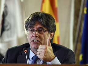 Catalan leader Carles Puigdemont speaks at a press conference in Alghero, Sardinia, Monday, Oct. 4, 2021. Catalonia's former separatist leader Carles Puigdemont walked out of a Sardinian courthouse Monday after a judge delayed a decision on Spain's extradition request and said he was free to travel. A Spanish judge has dropped sedition charges against former Catalan President Carles Puigdemont for his role in the region's illegal secession push in 2017 that brought Spain's most serious political crisis for decades, the court said in a statement Thursday, Jan. 12, 2023.