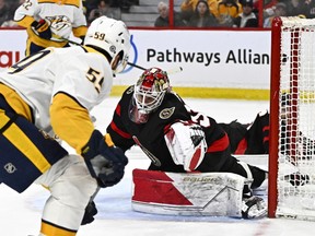 Ottawa Senators goaltender Cam Talbot (33) is scored on by Nashville Predators defenceman Roman Josi (59) during first period NHL hockey action in Ottawa, on Monday, Jan. 9, 2023.