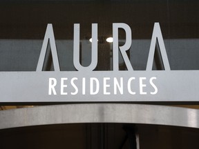 The sign on a condominium building is shown in Toronto on Tuesday, Jan. 17, 2023. A unit in the building was recently sold without the owner's knowledge. Mortgage and title fraudsters using actors to impersonate owners and tenants have targeted at least 32 properties in Ontario and British Columbia, investigators and official warnings suggest.