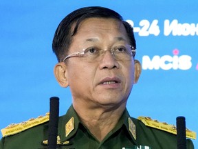 FILE - Commander-in-Chief of Myanmar's armed forces, Senior Gen. Min Aung Hlaing delivers his speech at the IX Moscow conference on international security in Moscow, Russia, June 23, 2021. Myanmar's military-controlled government has enacted a new law on registration of political parties that will make it difficult for opposition groups to mount a serious challenge to army-backed candidates in a general election set to take place later this year.
