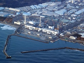 FILE - This aerial photo shows the Fukushima Daiichi nuclear power plant in Okuma town, Fukushima prefecture, north of Tokyo, on March 17, 2022. Japan's government has revised the timing of a planned release to the sea of treated but still radioactive wastewater at the Fukushima nuclear power plant to "around spring or summer," indicating a delay from the initial target of this spring, factoring into the progress of a release tunnel and the need to gain public support.