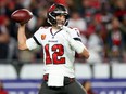 TAMPA, FLORIDA - JANUARY 16: Tom Brady #12 of the Tampa Bay Buccaneers throws a pass against the Dallas Cowboys during the second half in the NFC Wild Card playoff game at Raymond James Stadium on January 16, 2023 in Tampa, Florida.