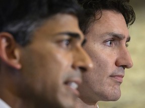 An association representing Canadian defence firms is adding its voice to those concerned about Canada's absence from a security pact between Australia, Britain and the United States. Canadian Prime Minister Justin Trudeau, right, and British Prime Minister Rishi Sunak hold a press conference at the G20 summit in Nusa Dua, Bali, Indonesia Wednesday, Nov. 16, 2022.