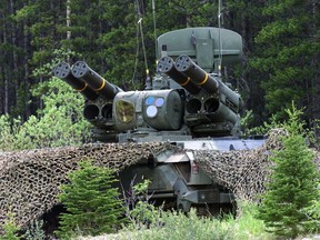 An camouflaged ADATS (Air Defense Anti Tank System) scans the skies deployed as part of G8 Summit security in the Kananaskis Valley, Saturday June 22, 2002.The federal Liberal government's plan to buy anti-aircraft missiles for Ukraine is prompting questions about why such equipment isn't being bought for the Canadian Army.