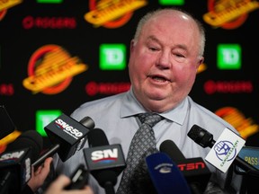 Vancouver Canucks head coach Bruce Boudreau responds to questions during a news conference after an NHL hockey game against the Edmonton Oilers, in Vancouver, on Saturday, January 21, 2023. The Vancouver Canucks have fired head coach Bruce Boudreau and hired Rick Tocchet as his replacement.